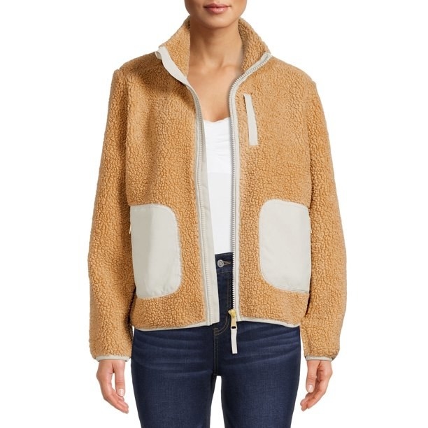 Model wearing tan sherpa jacket