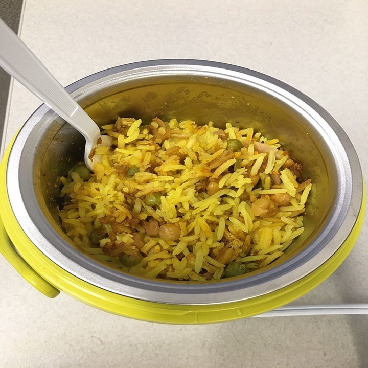 Reviewer's yellow crockpot with rice dish inside