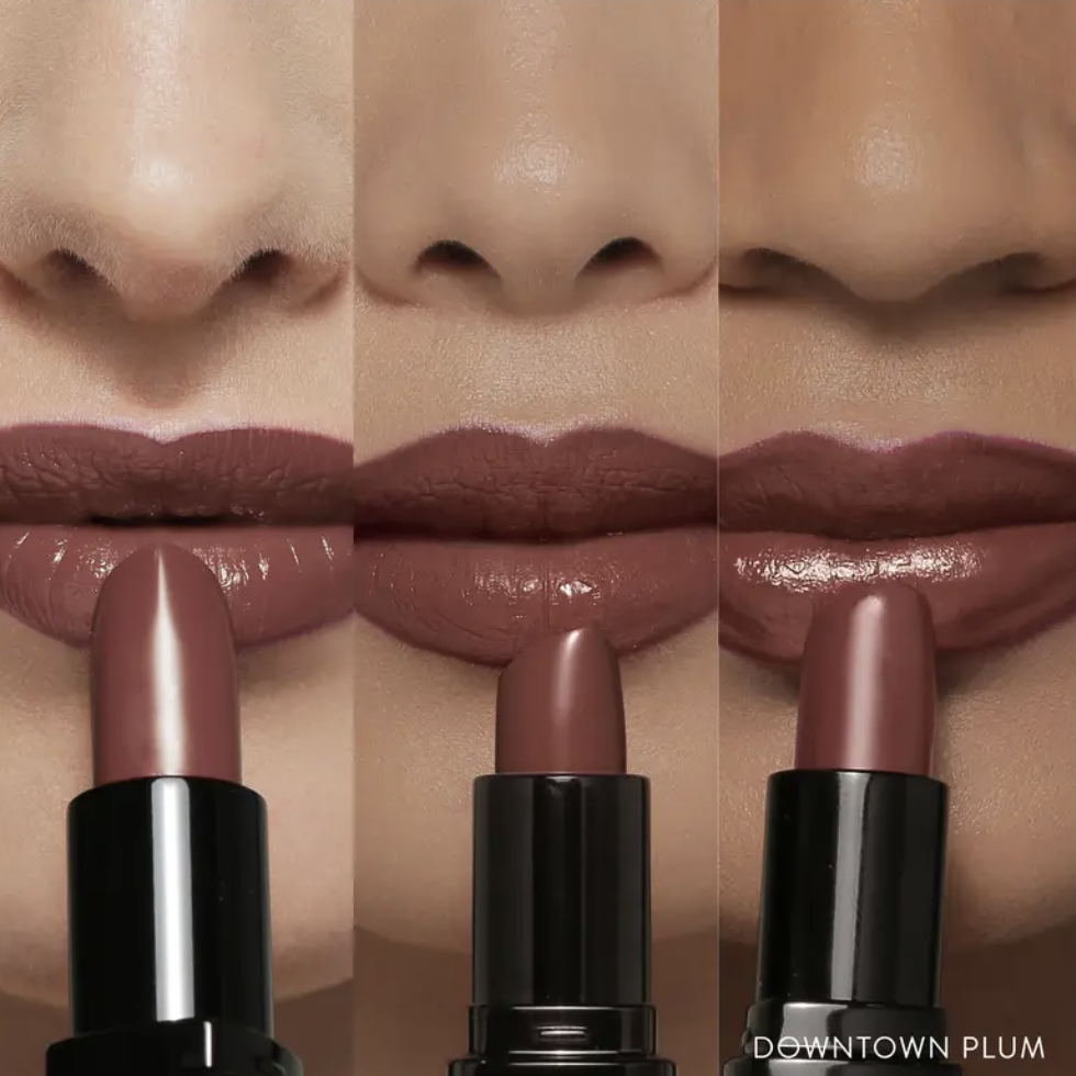 three sets of lips wearing the color downtown plum