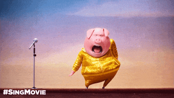 An animated pig dances on stage