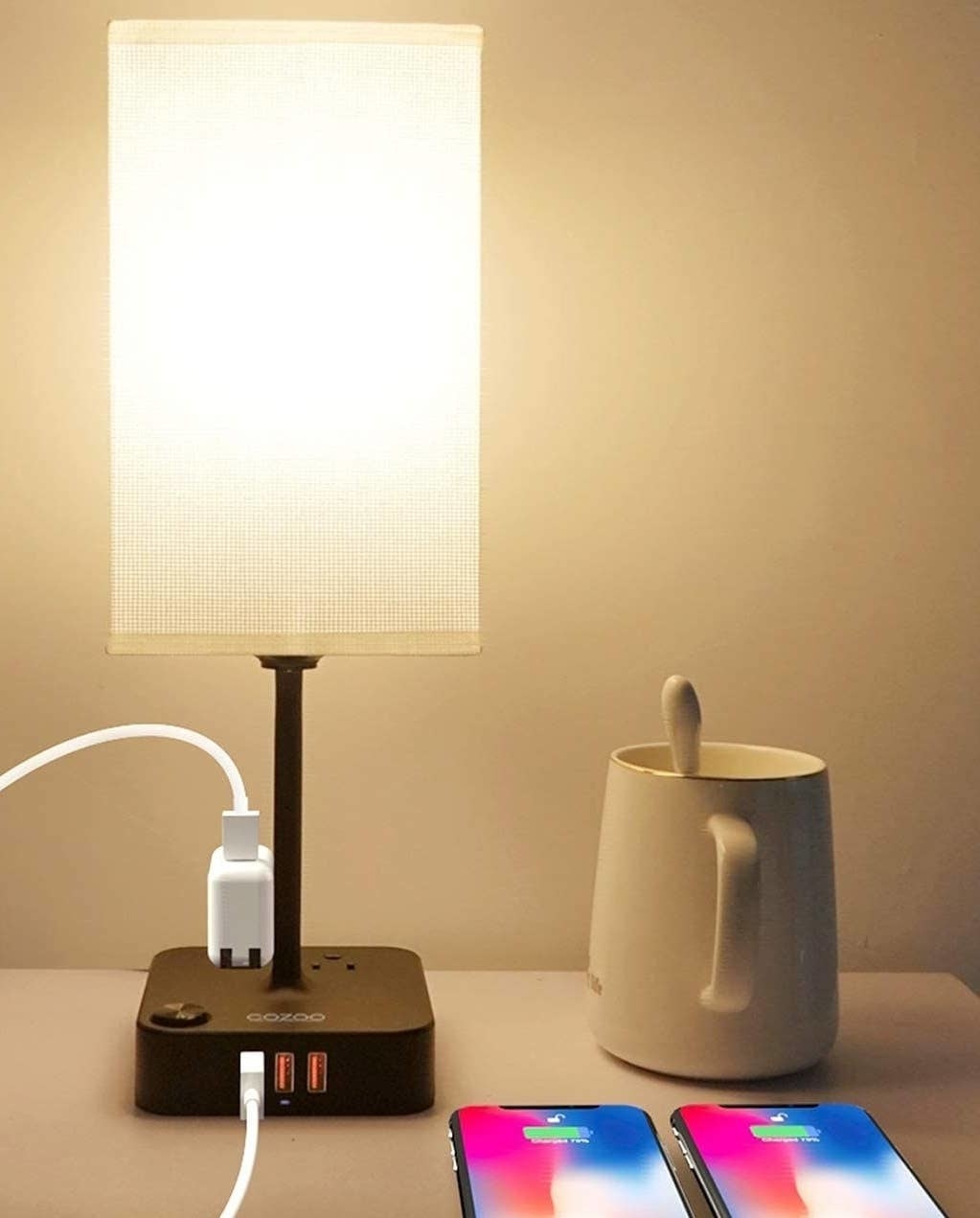 a lamp charging station on a side table