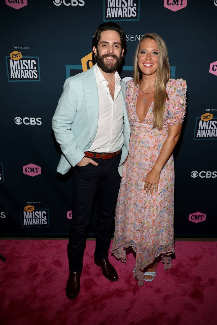 Thomas Rhett and Lauren Akins smile at the CMT Music Awards on April 11, 2022