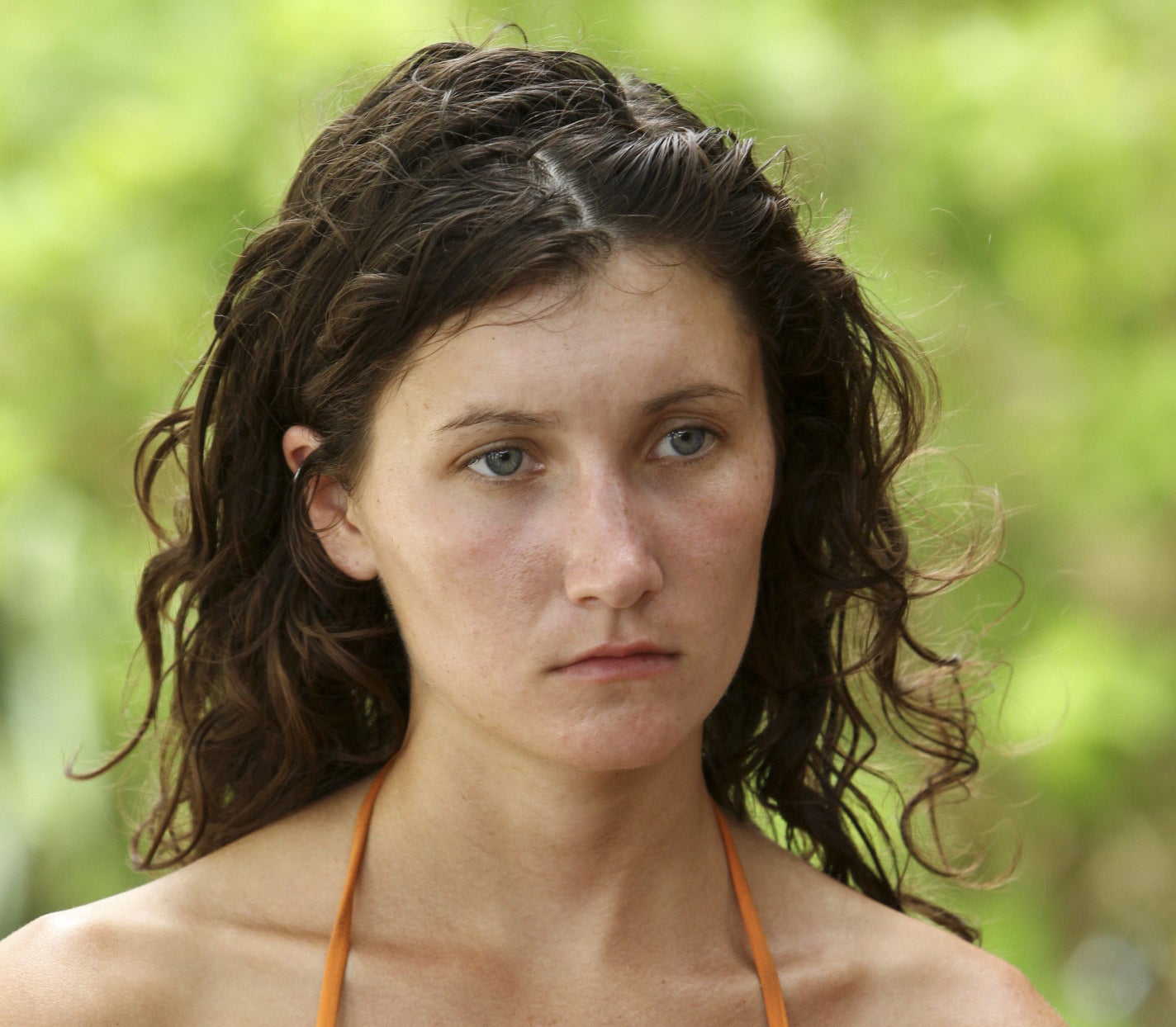 Julia Landauer stands in the woods