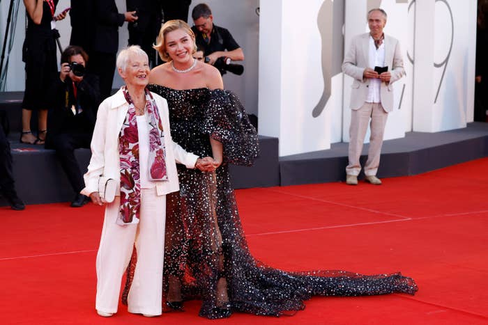 Florence and her grandma hold hands on the carpet