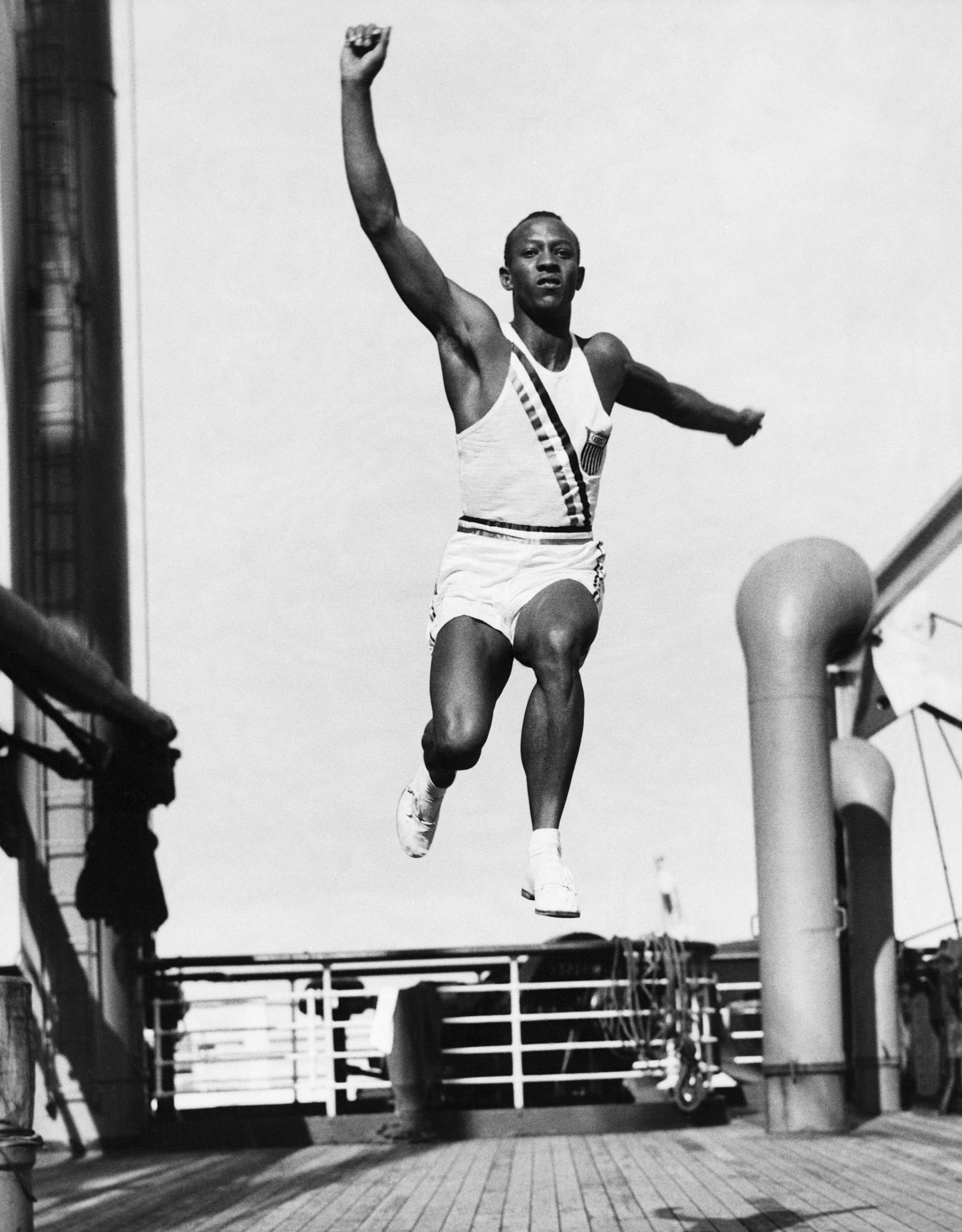 Jesse Owens practises the long jump on the deck