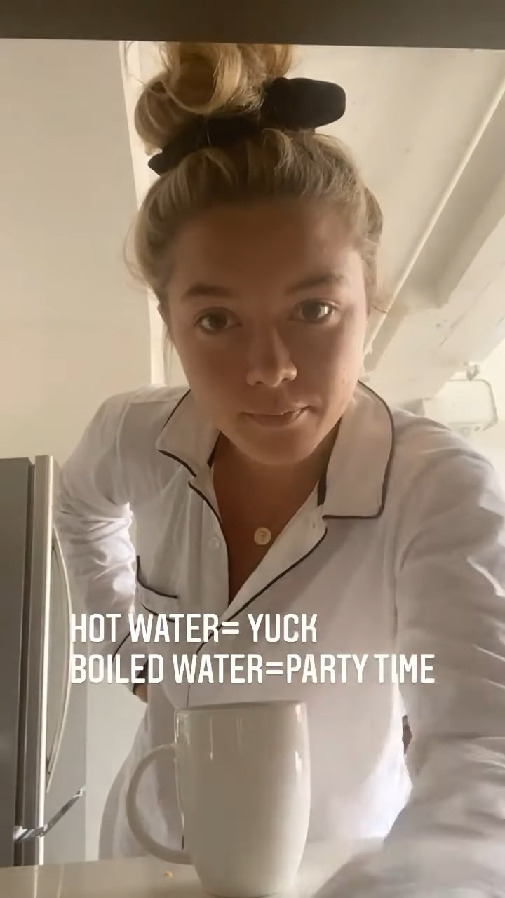 florence pugh with a cup of boiling water