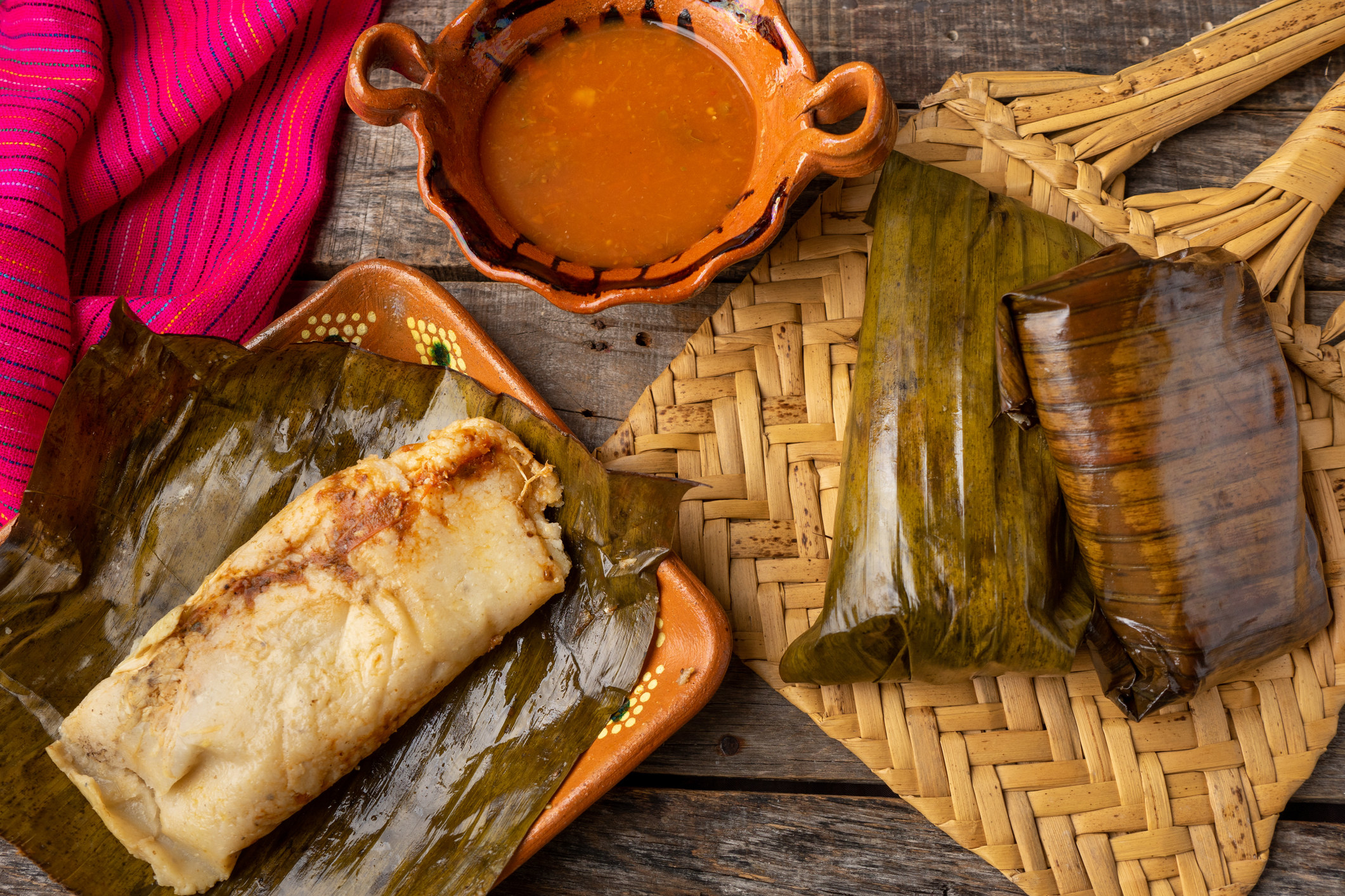 tamales wrapped in banana leaves