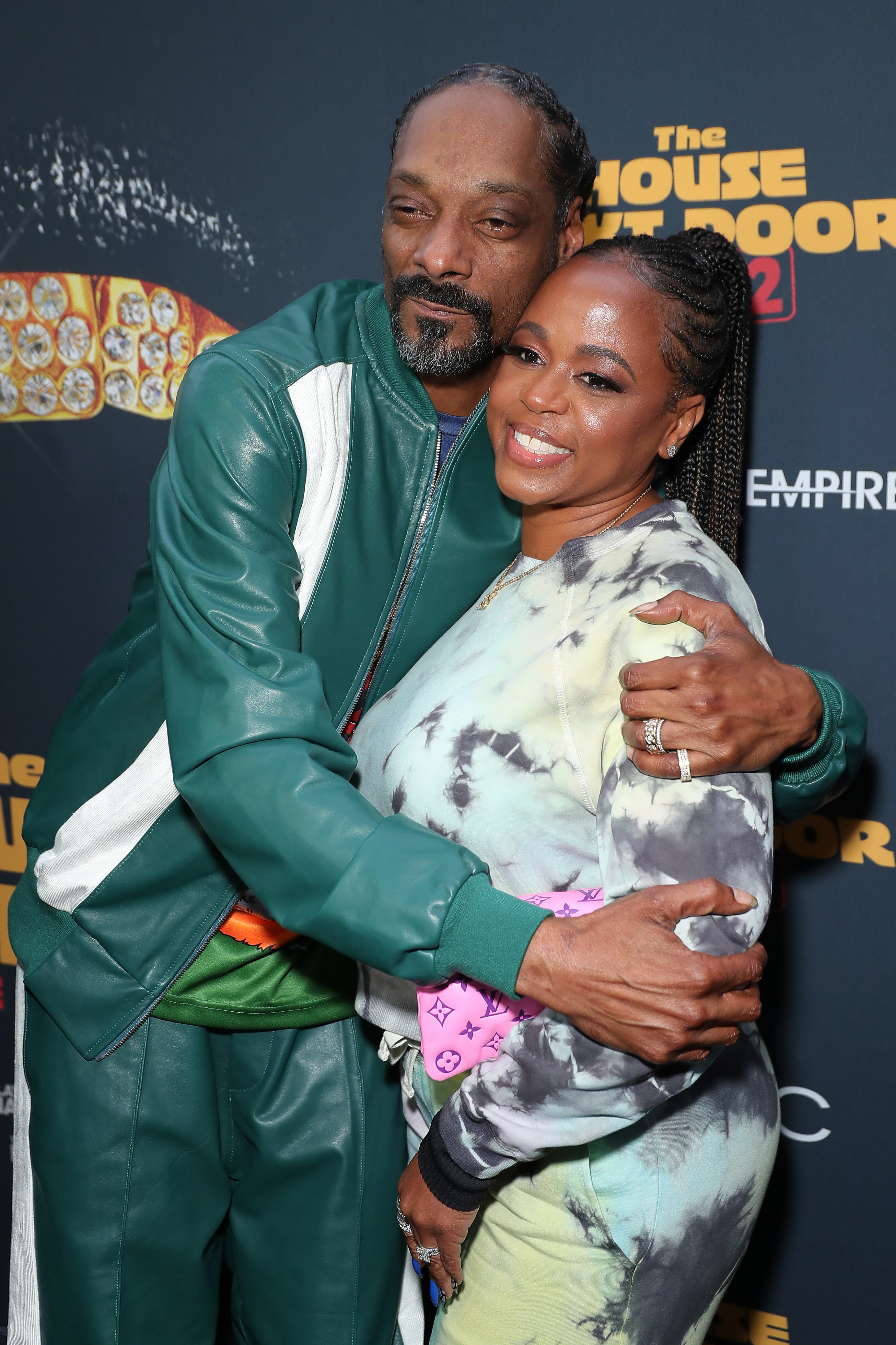 Snoop Dogg and Shante Broadus embrace on the red carpet of the &quot;The House Next Door: Meet the Blacks 2&quot; premiere on June 07, 2021