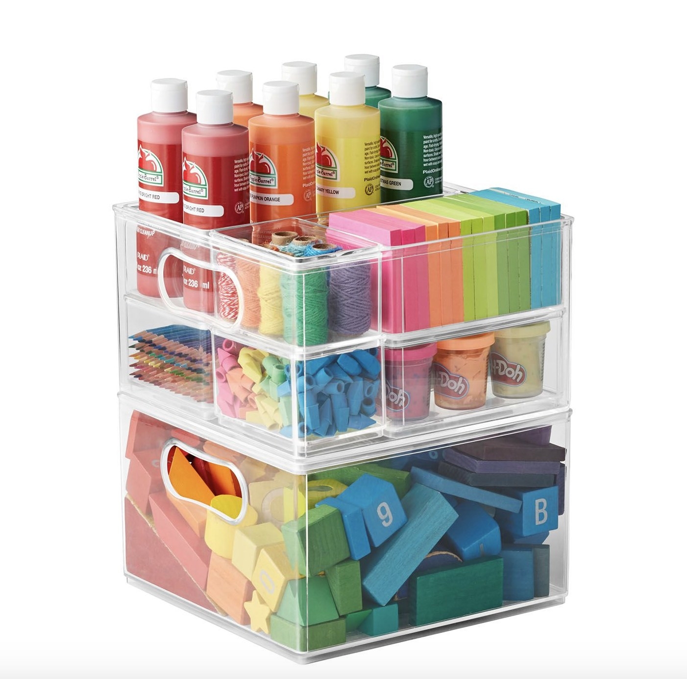 The plastic drawers have multicolored supplies inside