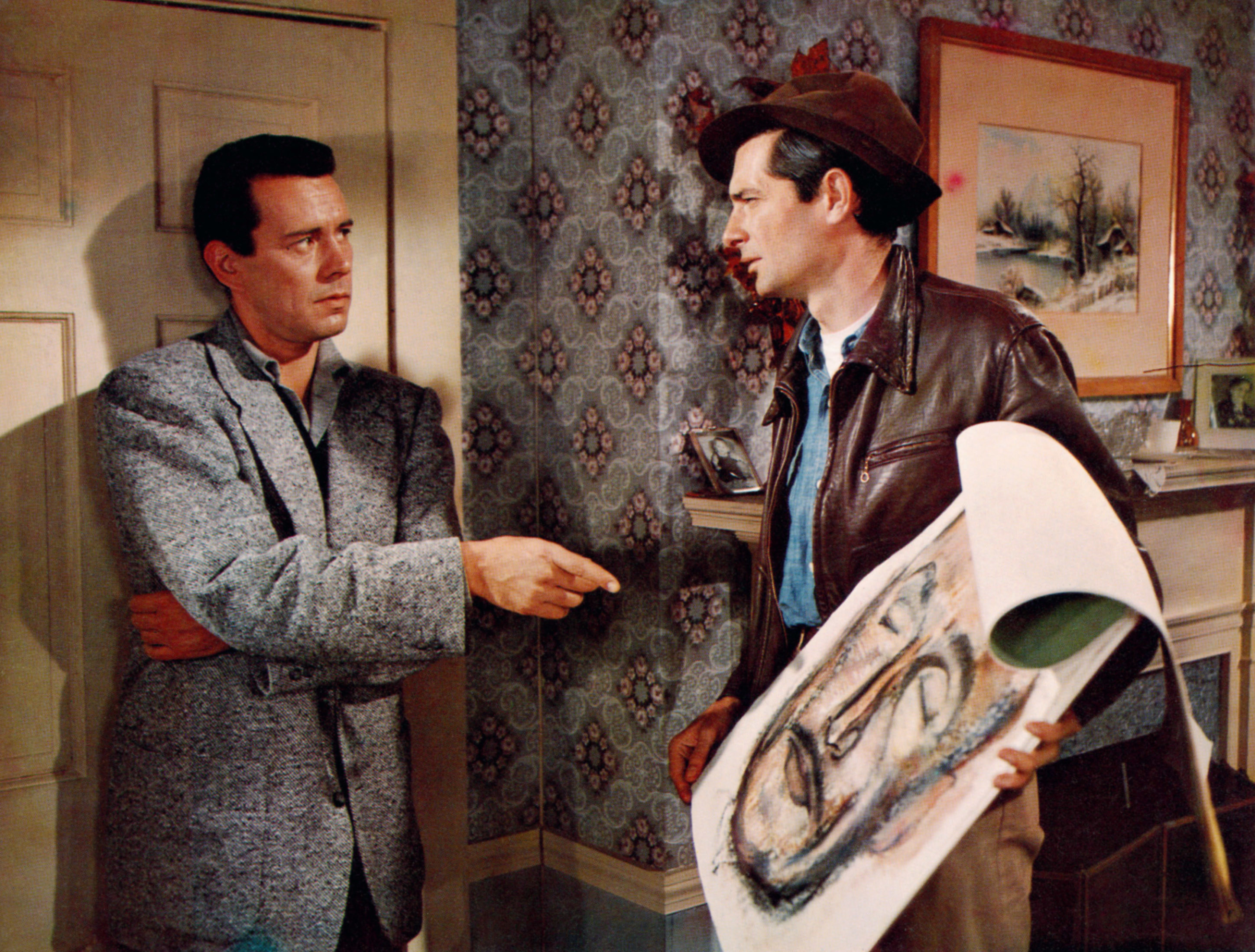 John Forsythe pointing at an illustration Royal Dano is holding.