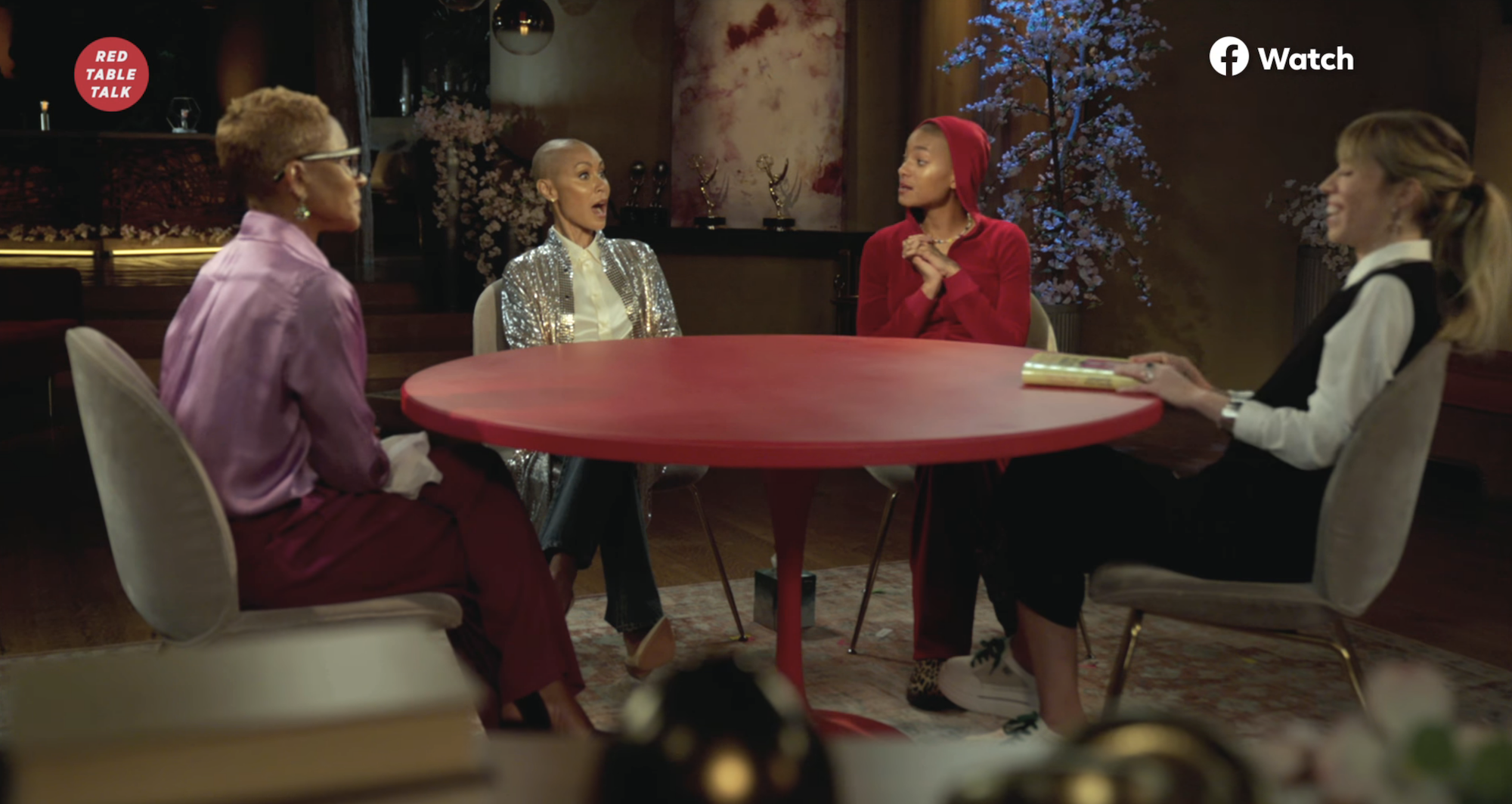 Jada Pinkett Smith and her mother Adrienne Banfield-Norris sitting around a table talking with Willow Smith and Jennette