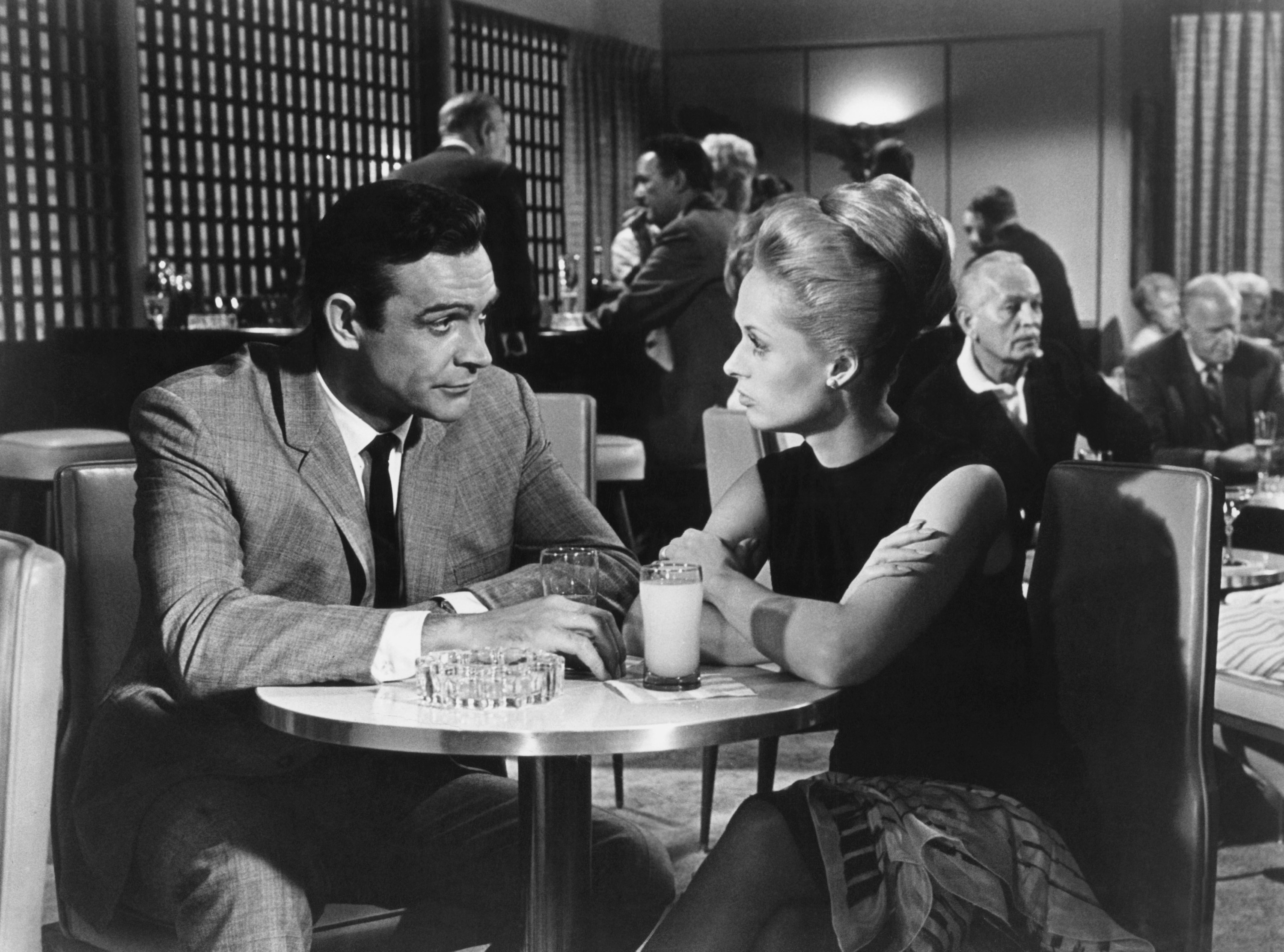 Sean Connery and Tippi Hedren sitting at a table.