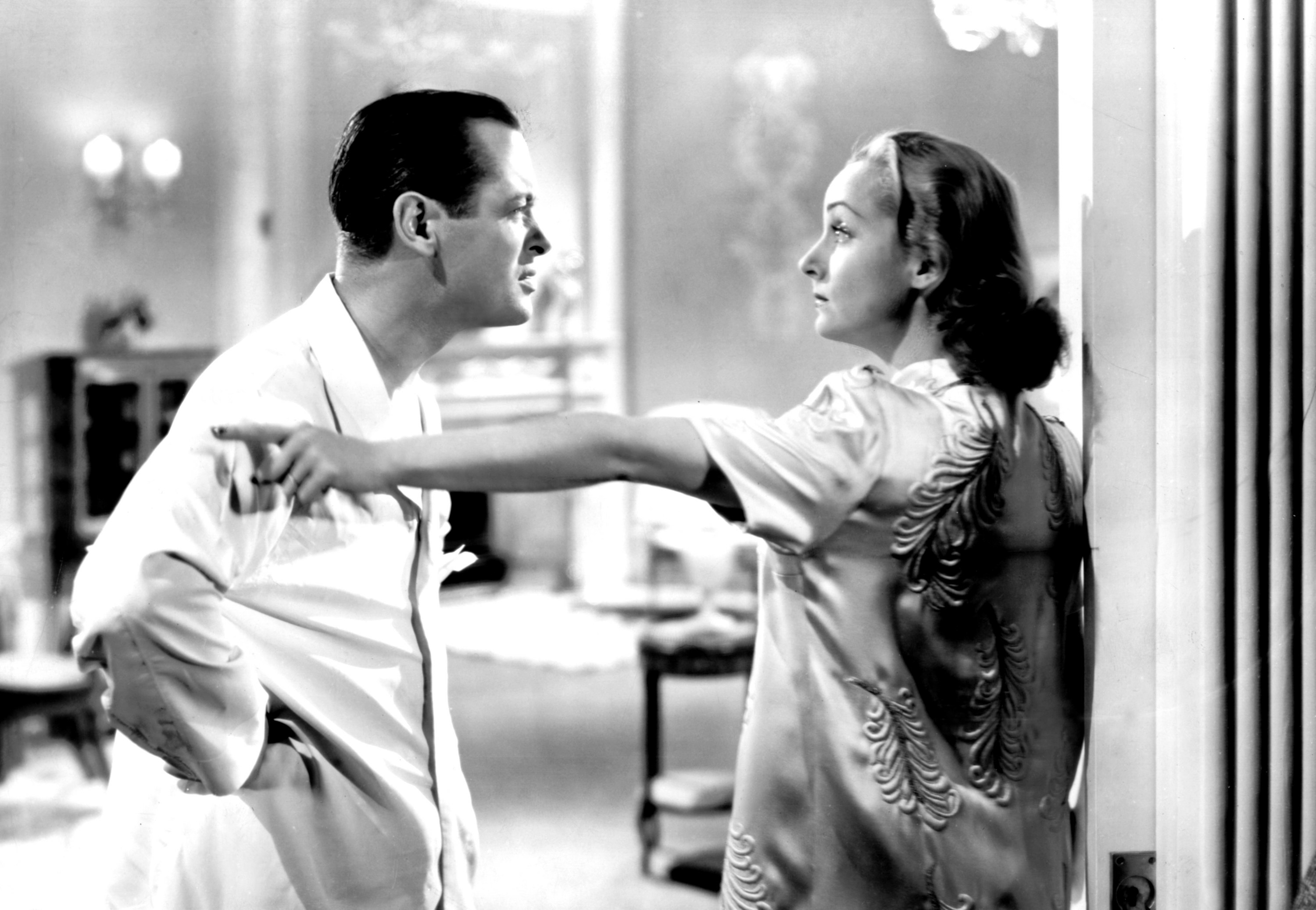 Robert Montgomery and Carole Lombard arguing.