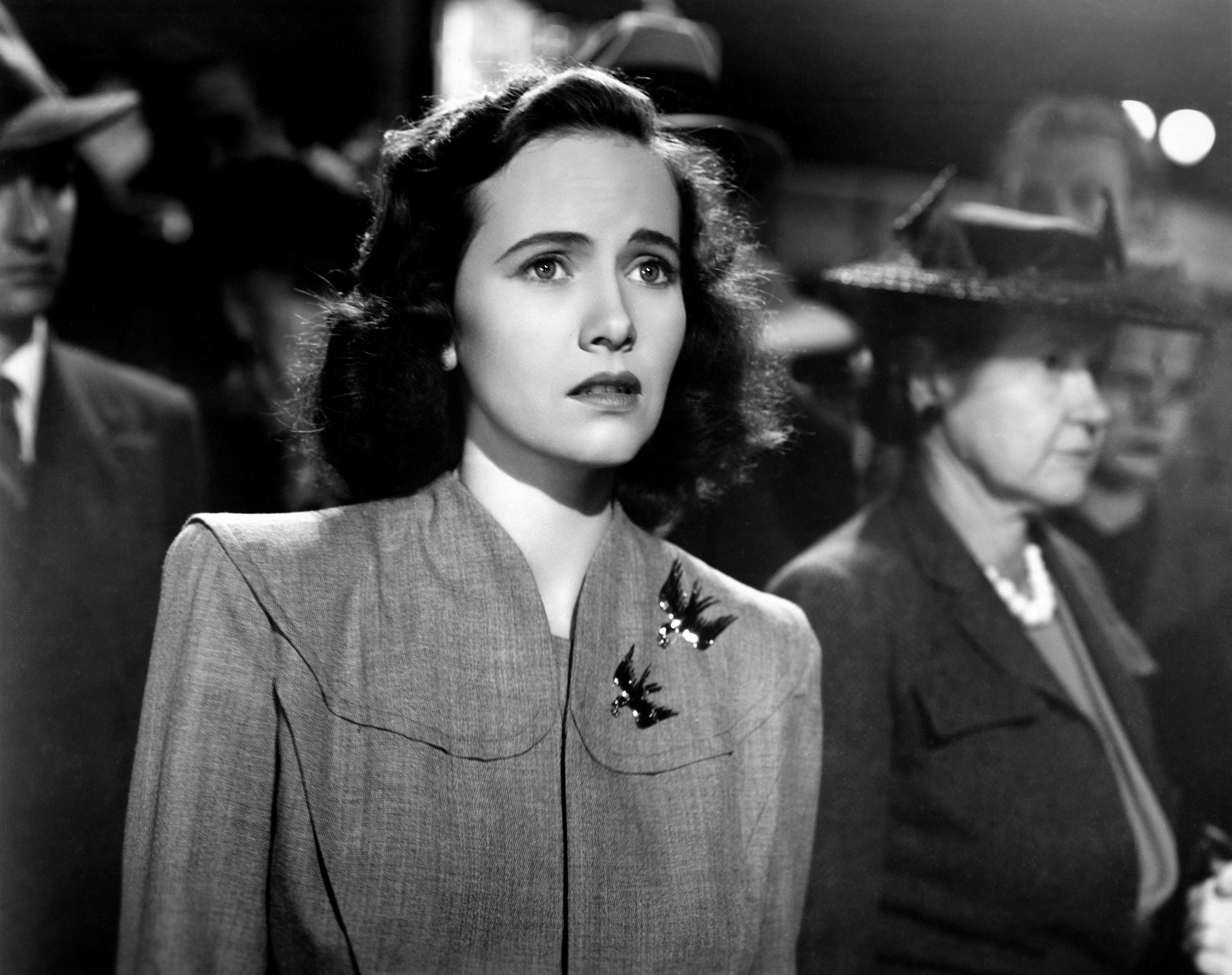 Teresa Wright looking concerned.