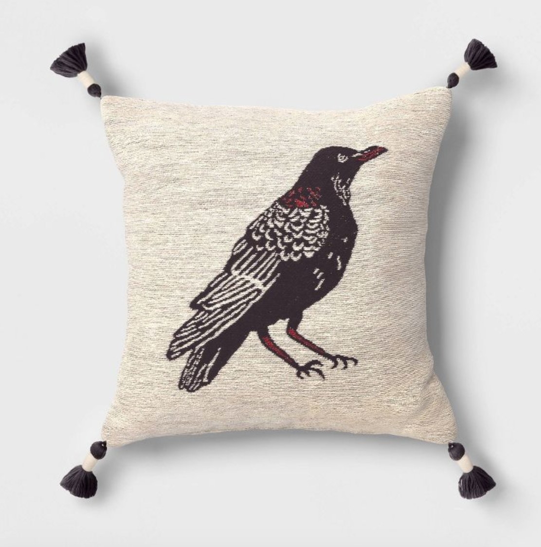 the throw pillow with a raven on it