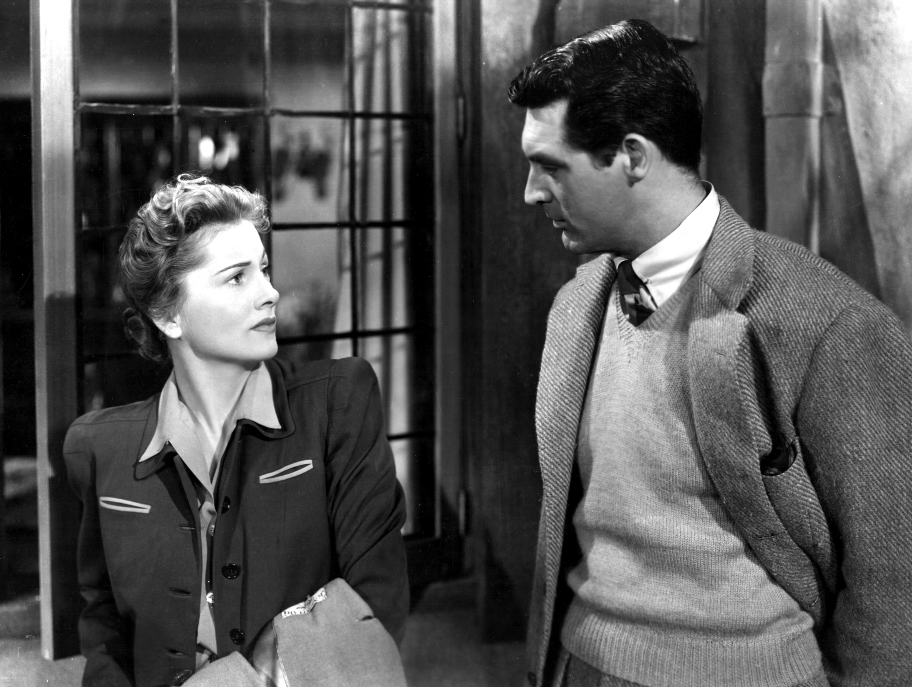 Joan Fontaine talking to Cary Grant.