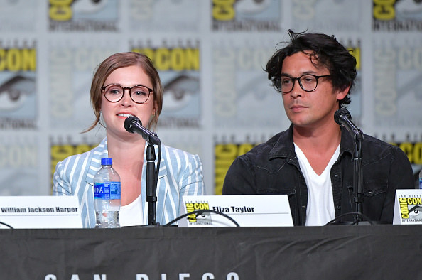 Eliza Taylor sitting next to Bob Morley on a panel at San Diego Comic-Con
