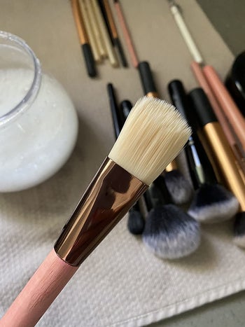The same makeup brush after being cleaned using the electric makeup brush cleaner