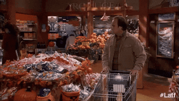 Man grabs a cart full of bread