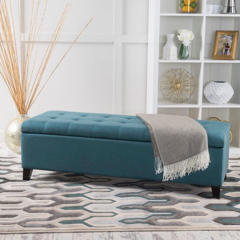 The ottoman in the color Dark Teal