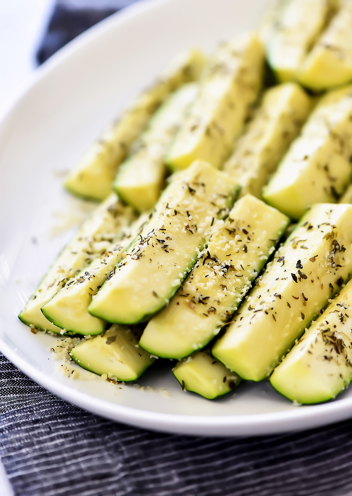 Zucchini slices sprinkled with parmesan cheese