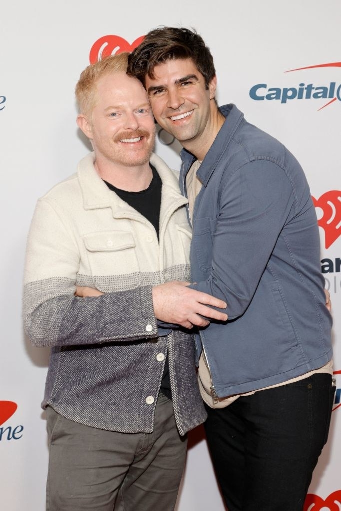 Jesse Tyler Ferguson wears a wool button up shirt and Justin Mikita wears a light colored jacket