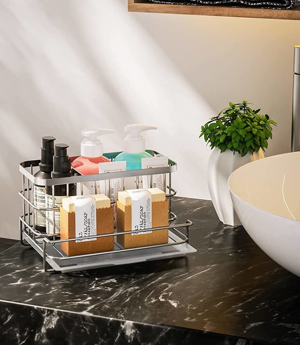 a sink caddy with various toiletries in it