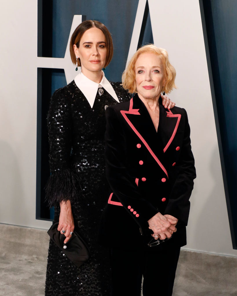 Sarah Paulson wears a sparkly gown and Holland Taylor wears a dark suit