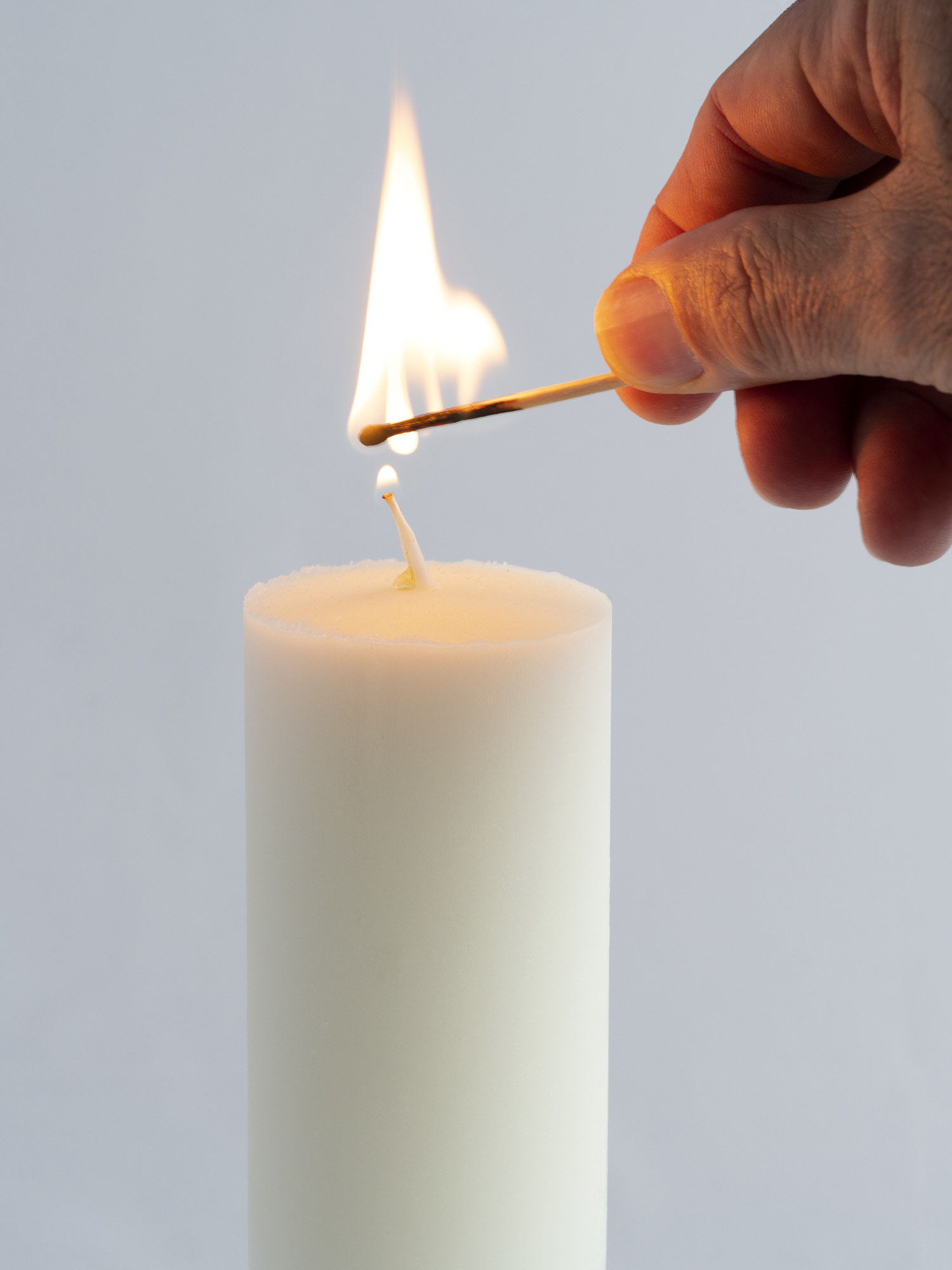 match lighting a candle