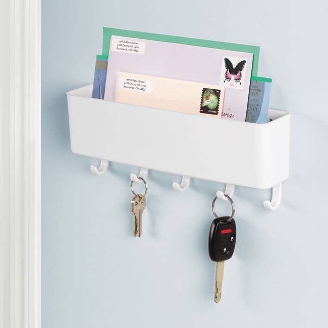white mail organizer on a wall 