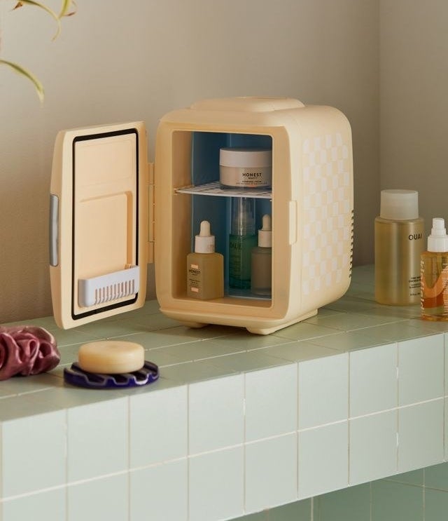 a cute skincare fridge on a counter