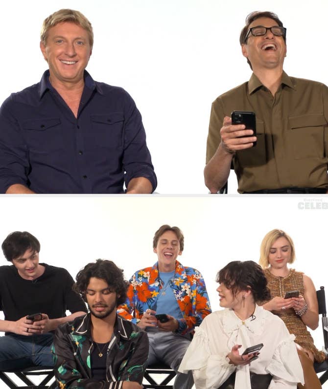 The cast taking the quiz on their phones