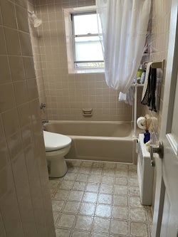 BuzzFeed writer's bathroom before the tiles