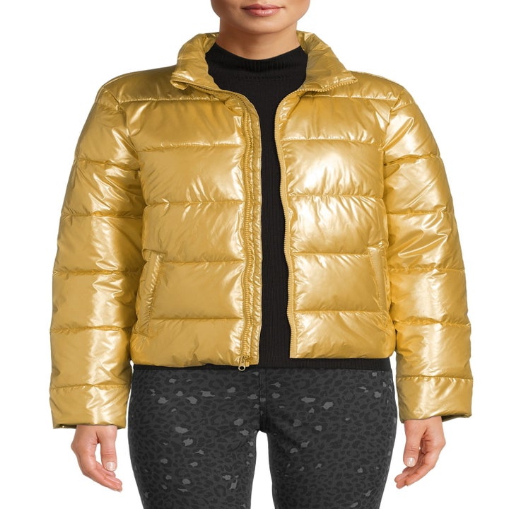 A model wearing the jacket in gold