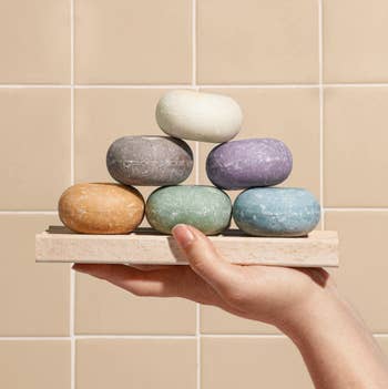 Six different scents of the shampoo bars stacked on top of each other