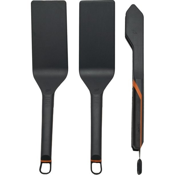 Two black spatulas and a black set of grill tongs
