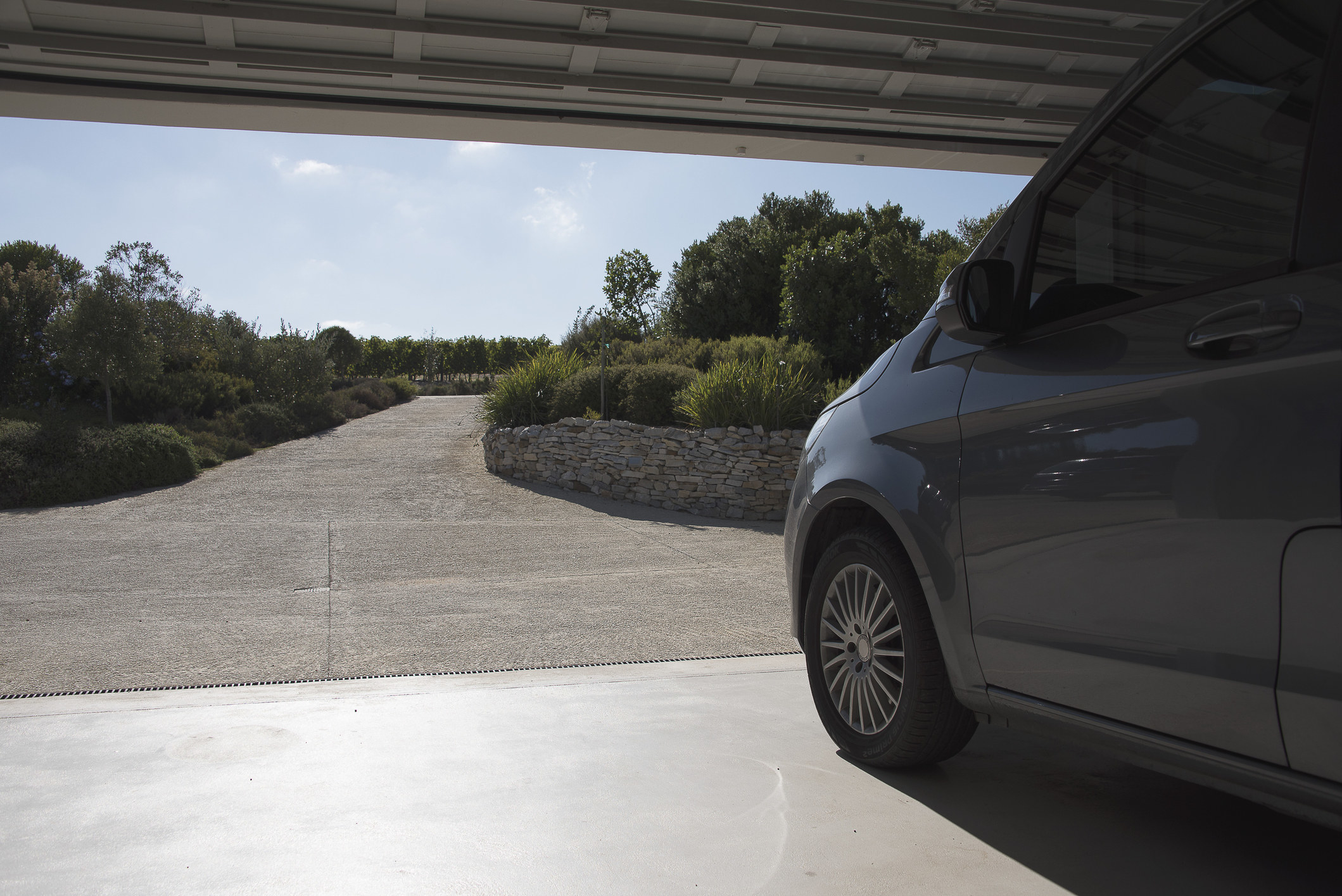 car headed towards driveway