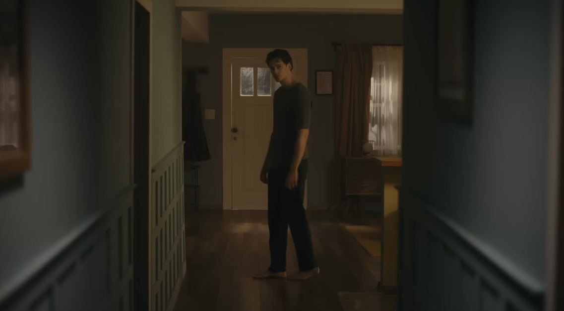 Keith looking down a hallway
