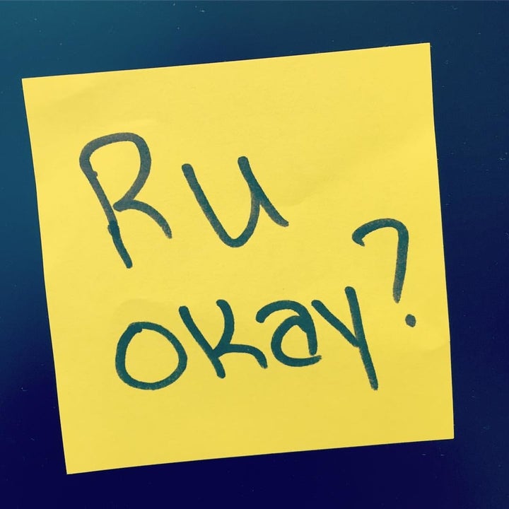 A yellow sticky note saying "R U Okay?"