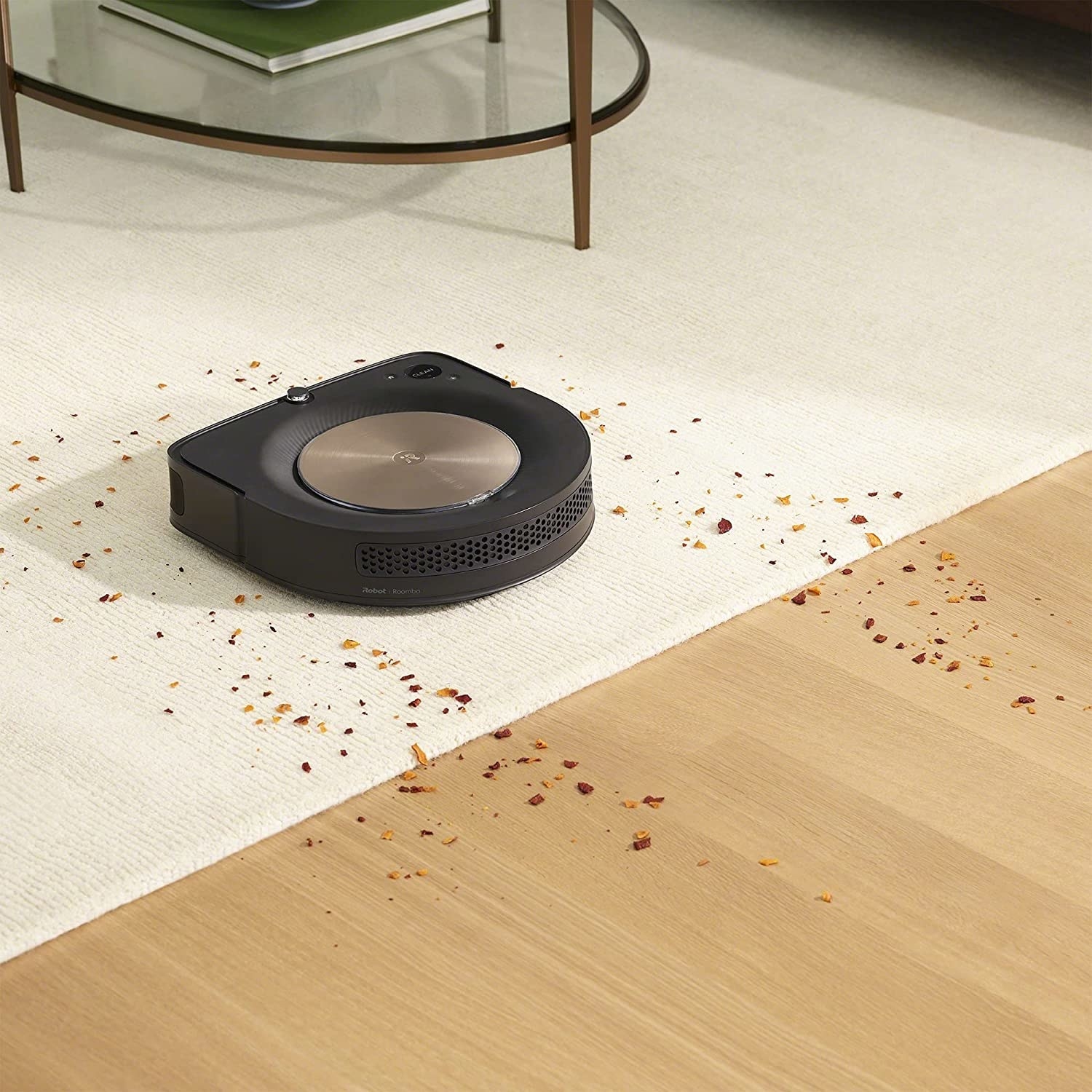 A Roomba Cleaning up a mess on a floor