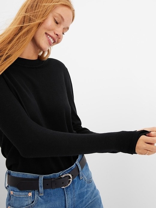 a person wearing the long sleeve wool crewneck