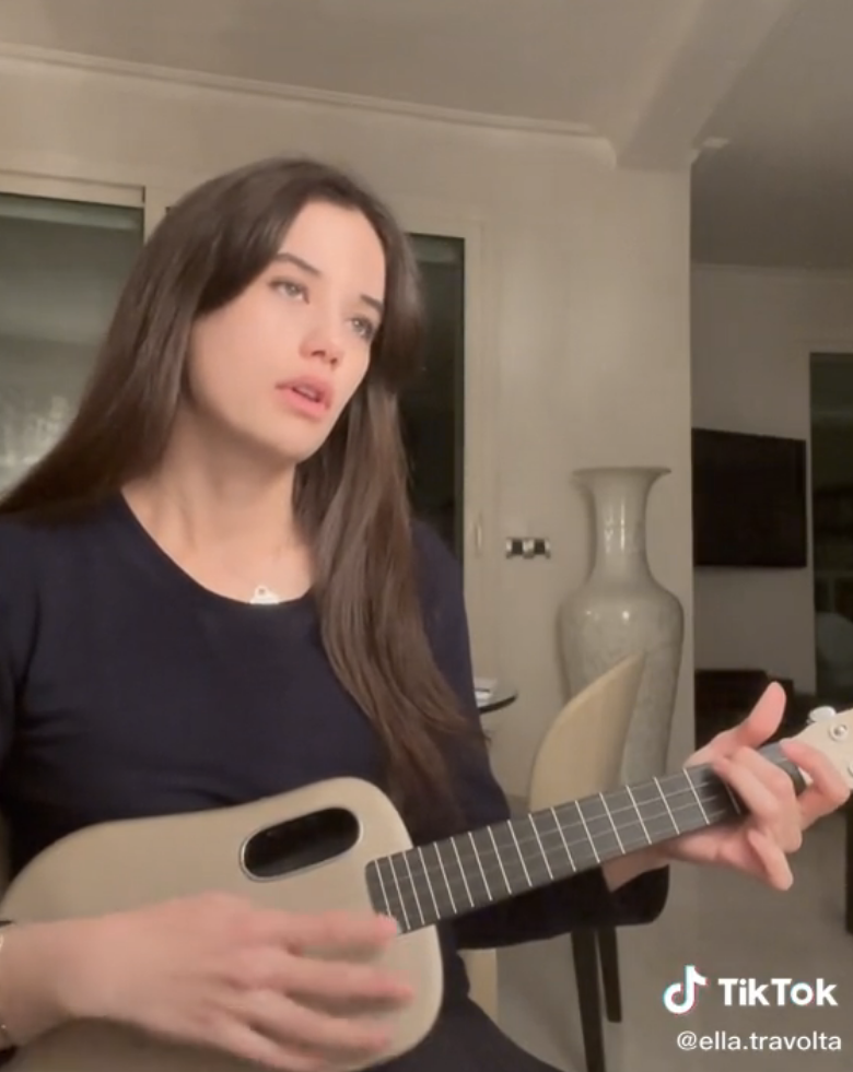 ella playing a ukulele