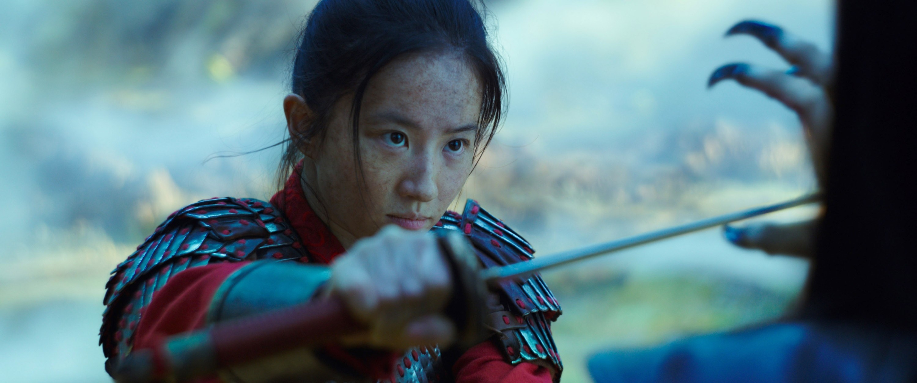 Liu Yifei holding a sword.