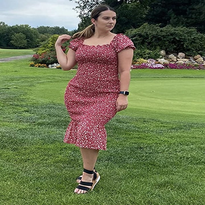 reviewer wearing the red dress