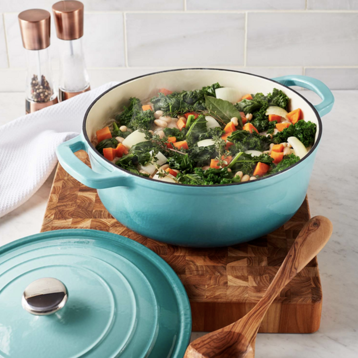 cast iron round dutch oven in a turquoise color with a heart meal made inside