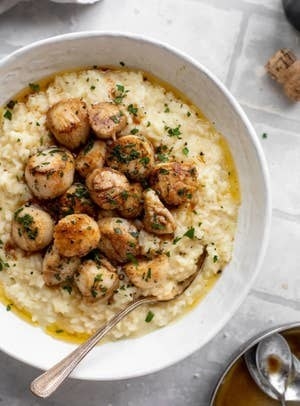Herb Brown Butter Scallops With Champagne Risotto in a bowl