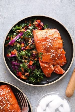 Maple Ginger Baked Salmon with salad on a plate