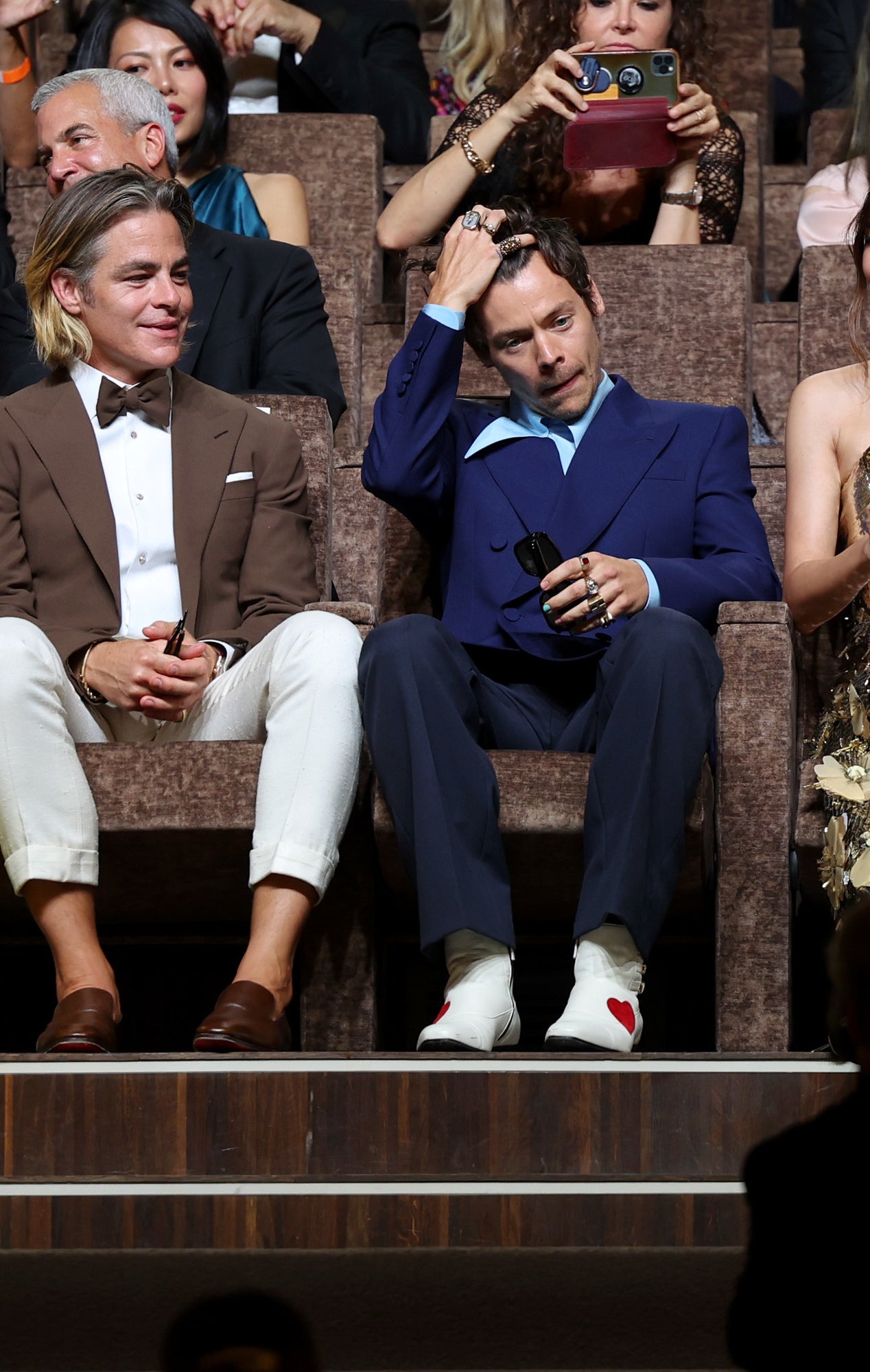 harry and chris sitting next to each other