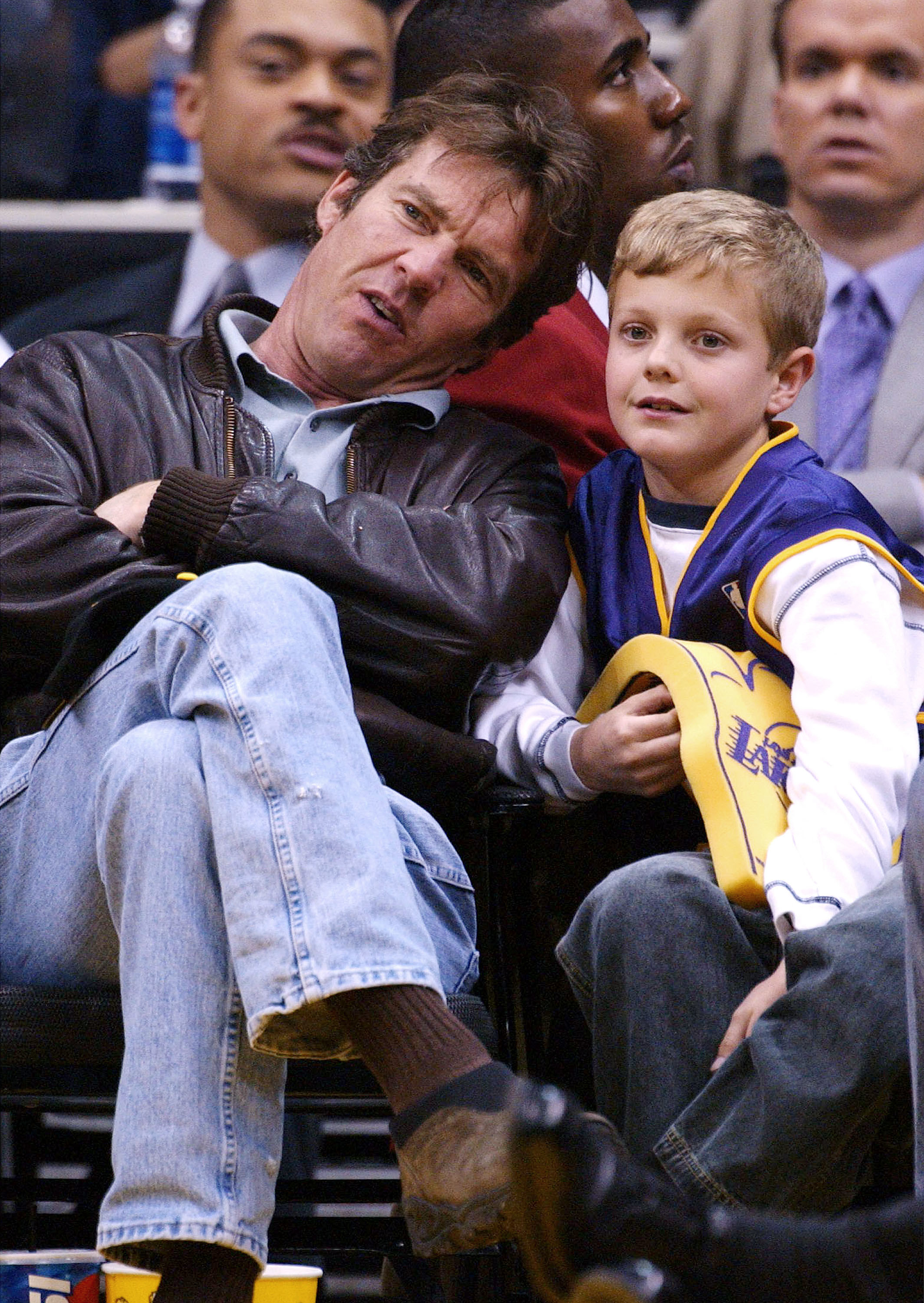 jack sitting next to his dad at a game