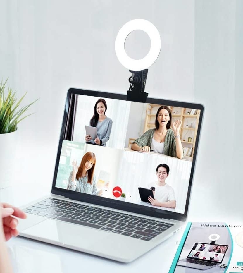 a ring light clipped onto the top of a laptop